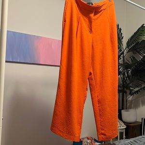 Orange seersucker-like wide, legged, dress pants